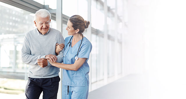 man walking with nurse mobile